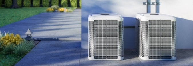 2 air conditioning units outside a home